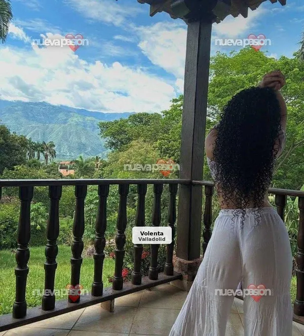 Curly, simple and authentic young woman